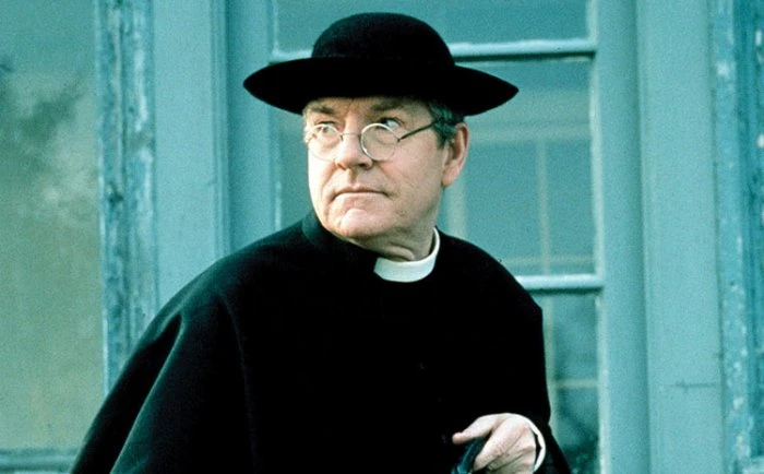 Kenneth Moore as Father Brown